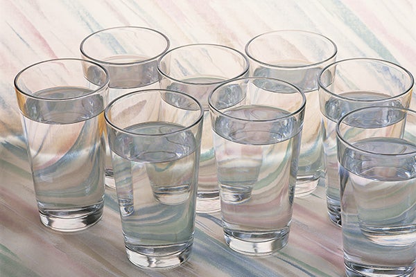 Several glasses of clean water on a table