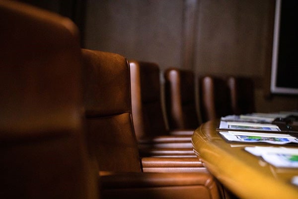 boardroom with table and chairs.