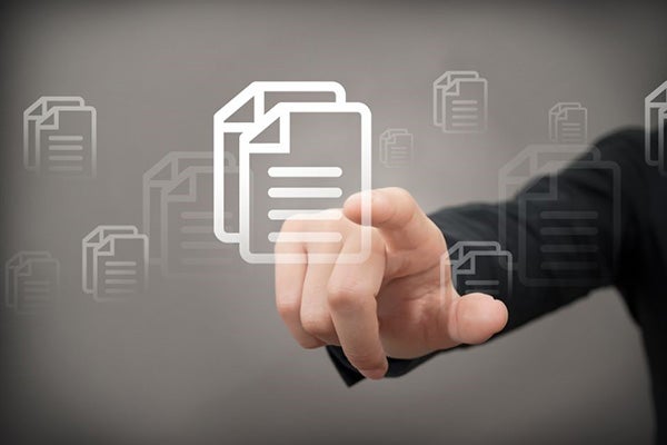 A hand reaching out to choose files from a virtual screen