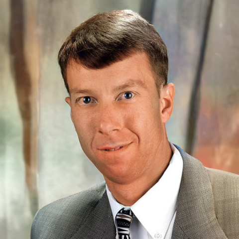 A black and white headshot of Jason Anderson