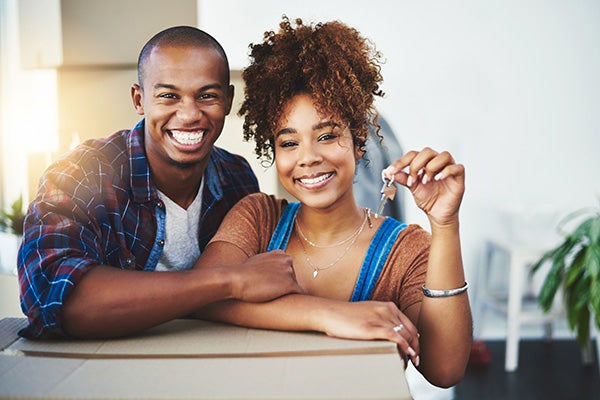 Shot of an attractive young couple moving houses